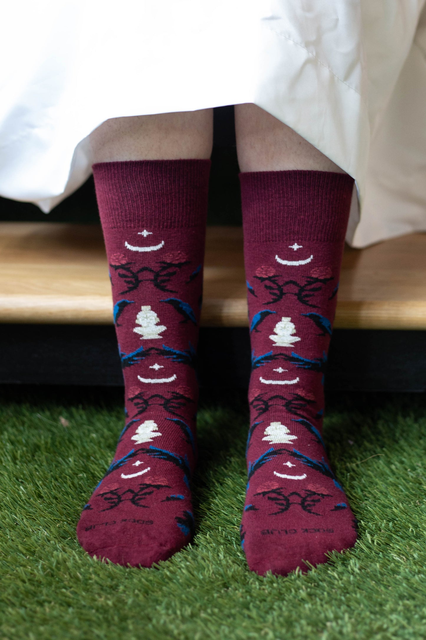 Close-up of a ghost wearing The Raven socks