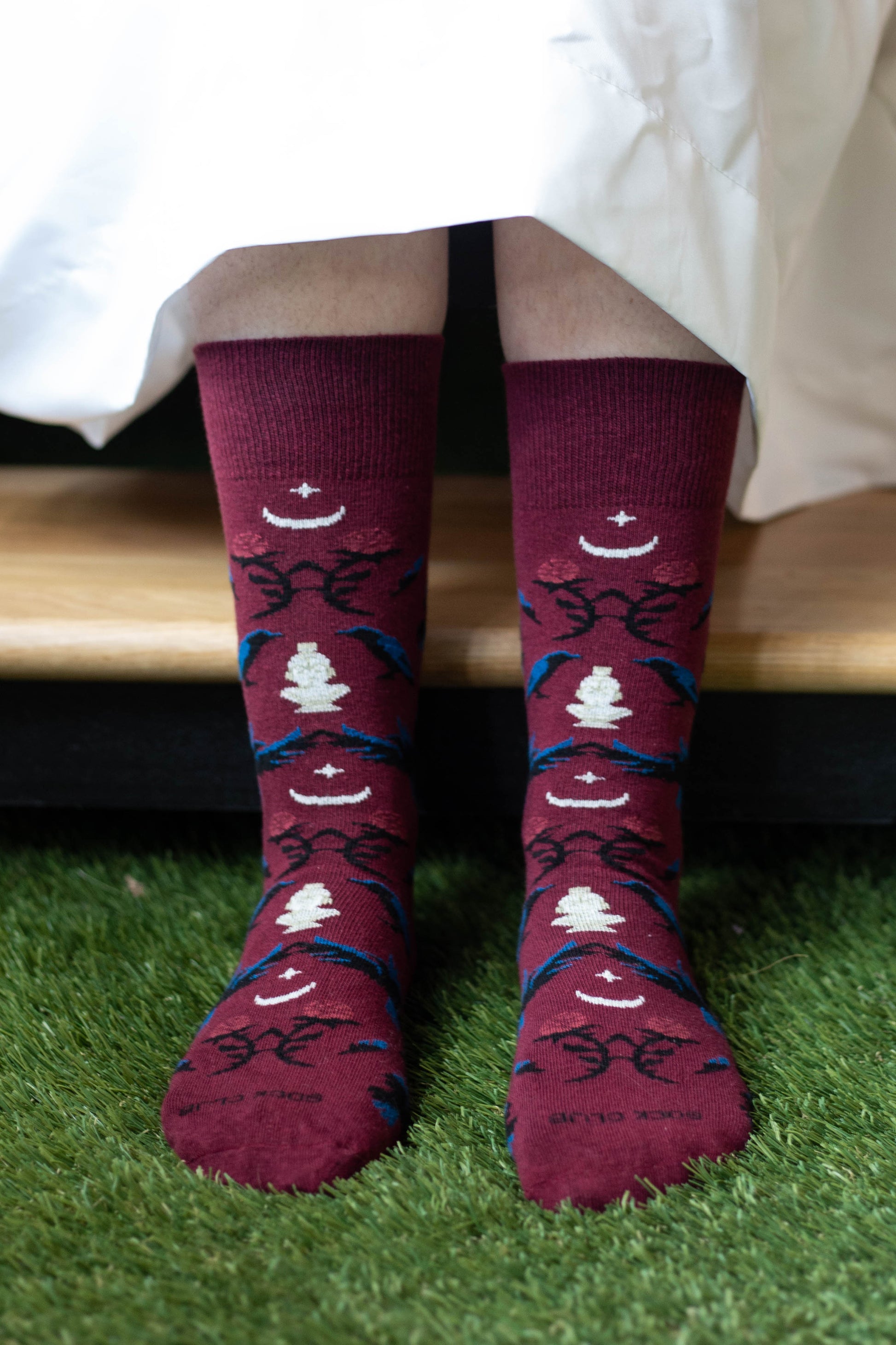 Close-up of a ghost wearing The Raven socks