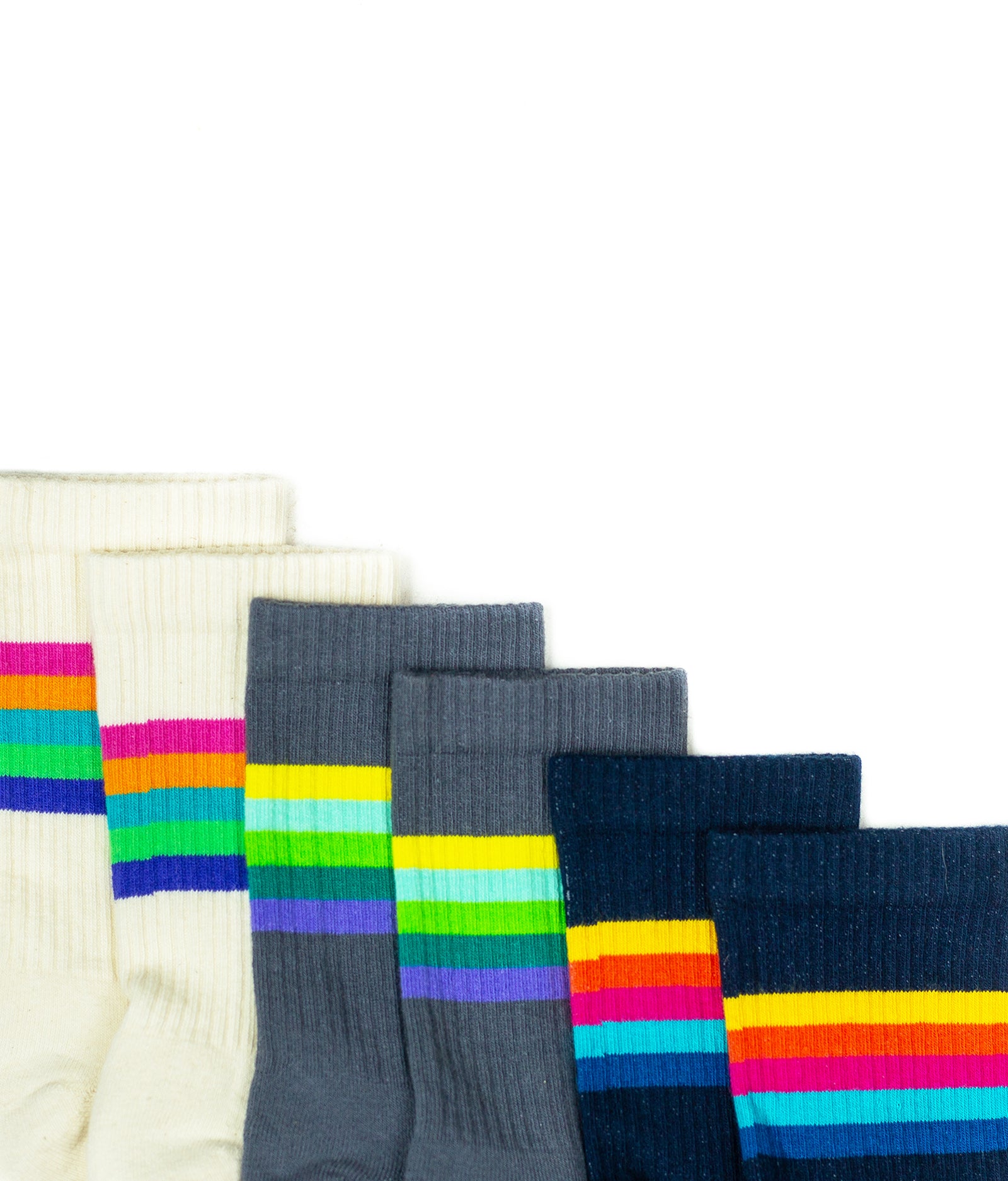 A layered collection of The Allen style sock in 3 color variations. From left to right: Natural, Concrete, Navy.